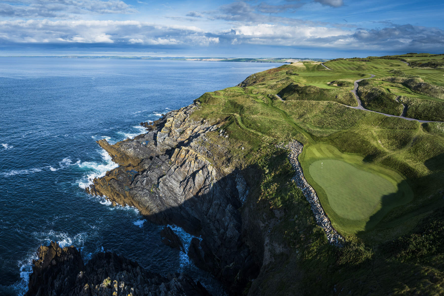 Old Head Golf Links' 16th hole, Coosgorm, in Kinsale, Co. Cork, Ireland, overlooking the Atlantic Ocean. 