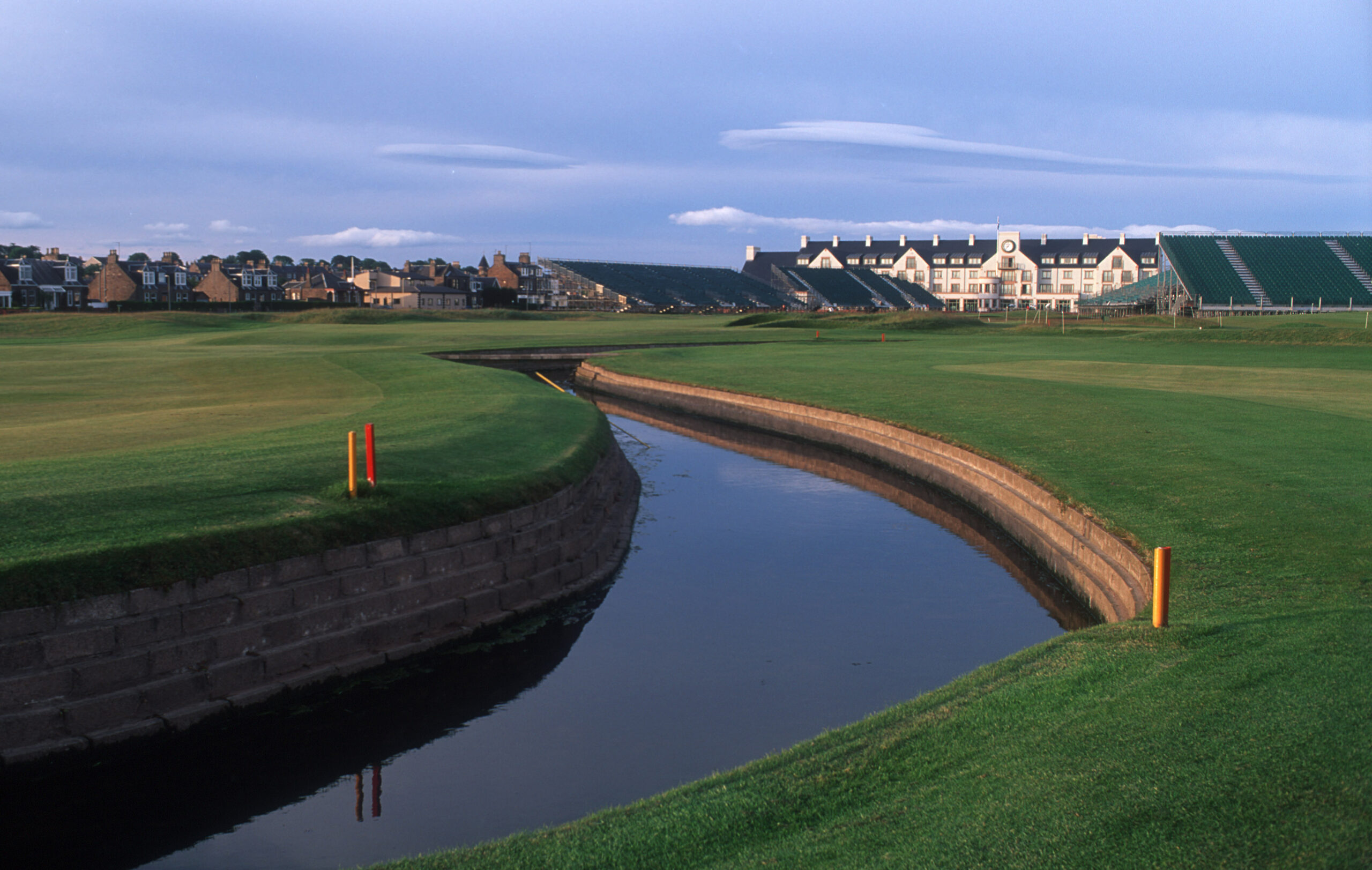 Looking over a water feature to the hotel at the golf course at Carnoustie Golf Links - a town and coastal resort, angus