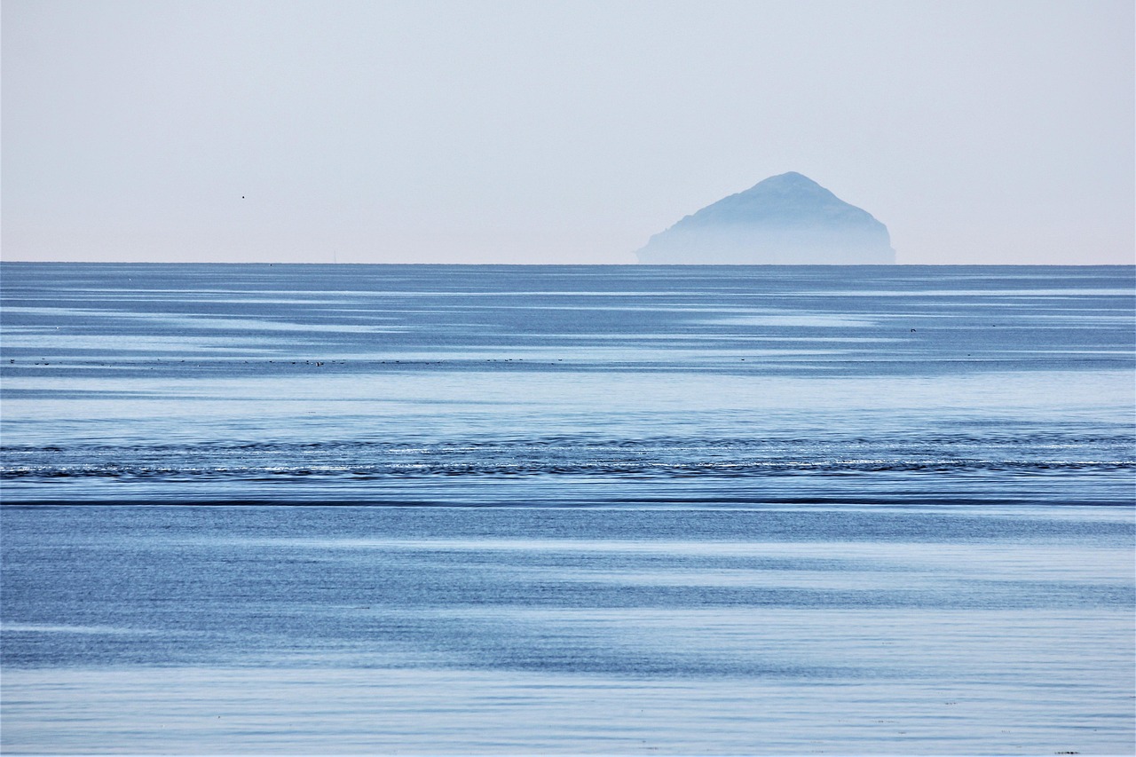 An image of the crisp north sea in the foreground with Aisla Craig in the background.